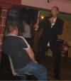 Comedian Mick Martin performing on the stage of the variety club Radfors Notts